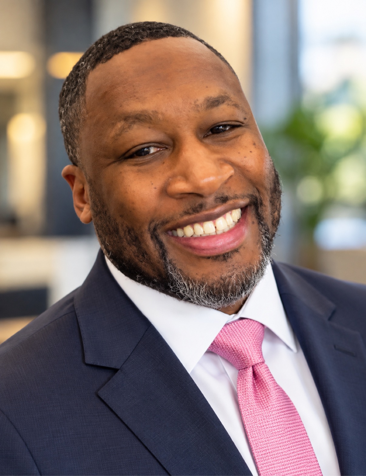 Professional headshot of Taj Harris, real estate agent